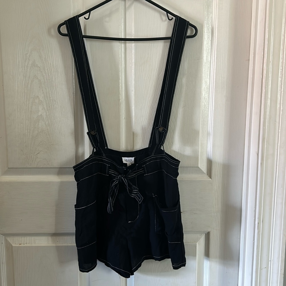 LELIS Black with white detail shorts romper.  Size small.  Loose fit.